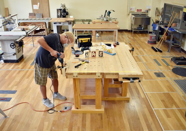 Wayne Hatfield drills a hole in a candleholder at the Camp Zama Arts and Crafts Center’s woodshop at Camp Zama, Japan, June 24.