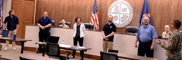 Garrison Commander Col. Harry Hung, right, thanks Unified School District 207 personnel Matt Dixon, technology media specialist;  Ross Viets, network administrator;  Liddell Hobin, director of Technology Services; Philip Barnett, technology...