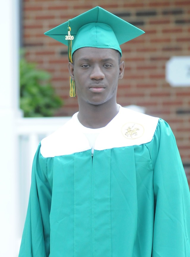 Jihad Banks, son Staff Sgt. Shalanda Banks, poses in front of his Fort Lee residence with his Prince George High School cap and gown. Banks is scheduled to graduate June 13 but without the pomp and circumstance of a traditional high school graduation due to the coronavirus.