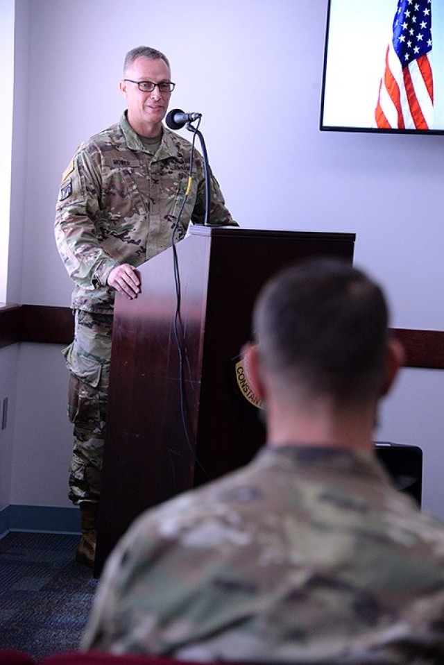 Outgoing Medical Department Activity and Munson Army Health Center Commander Col. Scott Mower addresses incoming MEDDAC and MAHC Commander Col. Garrick Cramer, a few present guests and ceremony participants, and viewers online during the change of...