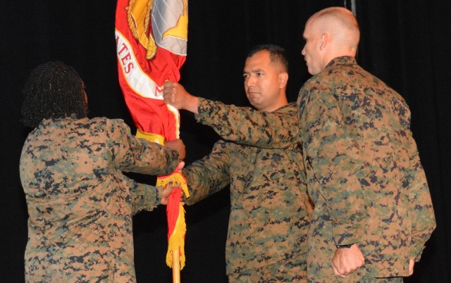 Lieutenant Col. Julian M. Tsukano becomes the commanding officer of Marine Detachment Fort Lee upon receipt of the organization’s colors June 19 from departing commander Lt. Col. Morina D. Foster as Sgt. Maj. Robert M. Moyer observes. Tsukano comes to Fort Lee from a previous assignment as current operations officer, Marine Forces South. Foster has been reassigned to Pennsylvania State University where she has been selected to a logistics fellowship.
