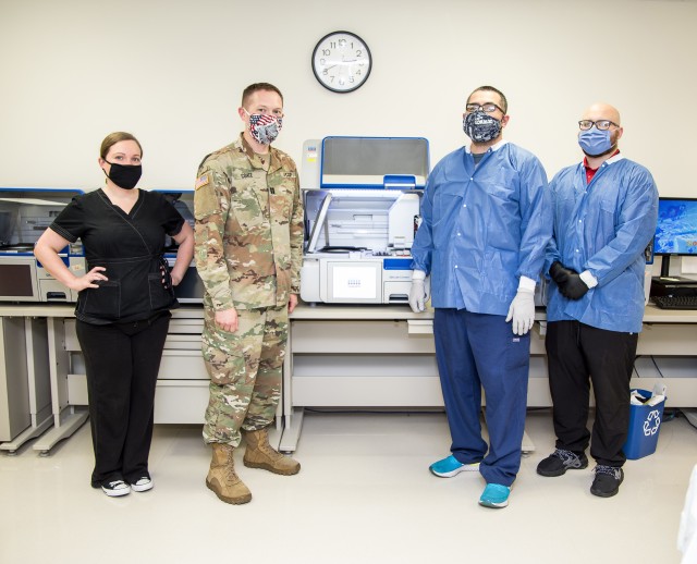 Molecular team members demonstrate molecular ribonucleic acid extraction equipment at Brooke Army Medical Center, Fort Sam Houston, Texas, June 1, 2020. BAMC is actively paving the way for patients to know whether or not they have the virus in a...