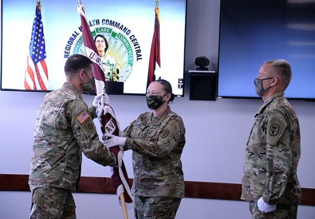 As Brig. Gen. Wendy Harter, deputy commanding general of Regional Health Command-Central and commander of Brooke Army Medical Center, oversees from Joint Base San Antonio-Fort Sam-Houston in Texas, incoming Medical Department Activity and Munson Army Health Center Commander Col. Garrick Cramer returns the colors to MEDDAC and MAHC Sgt. Maj. Kristine Quinn during his change of command with outgoing MEDDAC and MAHC Commander Col. Scott Mower June 24 at MAHC. The ceremony was broadcast live on Facebook. Photo by Prudence Siebert/Fort Leavenworth Lamp