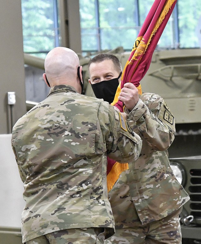 Col. Stephen F. Elder, incoming interim Chief of Ordnance and Explosive Ordnance Disposal Commandant, accepts the corps’ colors from Maj. Gen. Rodney D. Fogg, CASCOM and Fort Lee commanding general, during a COVID-19-restricted Ordnance Corps Relinquishment of Command Ceremony May 18 at the Ord. Training Support Center. Elder took over duties and responsibilities for Brig. Gen. Heidi J. Hoyle, who is scheduled to be the next commanding general of the 20th Chemical, Biological, Radiological, Nuclear and Explosives Command (CBRNE), Aberdeen Proving Ground, Md.