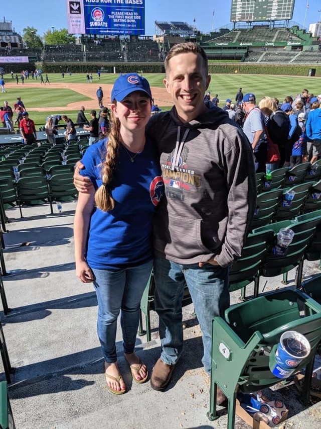 Capt. Jacob Henry and his wife Jenna at a Chicago Cubs game at Wrigley Field.