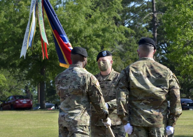 U.S. Army Training Center and Fort Jackson Commander Brig. Gen. Milford “Beags” Beagle Jr., left, passes the 193rd Infantry Brigade colors
to incoming Commander Col. Mark E. Huhtanen during a change of command ceremony June 19 at Victory Field. Col. John “JC” White
officially relinquished his duties and responsibilities to Huhtanen with the passing of the brigade’s colors.
