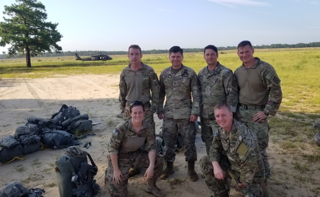 Capt. Katie Nisbet, front left, with several members of the 722nd Explosive Ordnance Disposal Company at Fort Bragg, N.C., July 31, 2019.