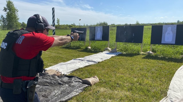 Corry Bibey, Fort Drum Security Detachment marksmanship trainer, fires an M9 pistol during qualification training June 19, 2020, on Fort Drum, N.Y.