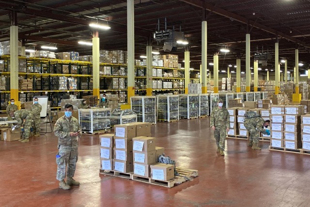 Members of the New York National Guard, organize and prepare to distribute distribute COVID 19 swab  test kits  in The Bronx, N.Y., May 26, 2020. New York National Guard members are supporting the multi-agency response to COVID-19. 