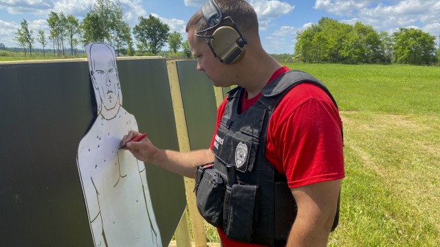 Kenneth Hanners, a guard with the Fort Drum Security Detachment of 100th Missile Defense Brigade scores a target during a small arms qualification training range June 19, 2020, on Fort Drum, N.Y.