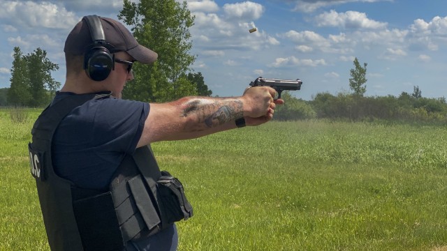 Jeremy Walton, a guard with the Fort Drum Security Detachment of 100th Missile Defense Brigade fires an M9 during a small arms qualification training range June 19, 2020, on Fort Drum, N.Y.