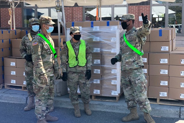 U.S. Army Sgt. Umar Inniss tasks, from left, Spc. Norckenly Cadet, Sgt. Hamlet Suazo and Pvt. Melanie Cruz to ensure the cars get loaded with the right number of meals for city residents at the Queens Food Distribution Site May 10, 2020. The Soldiers are assigned to the New York Army National Guard’s 1st Battalion, 258th Field Artillery, part of the 27th Infantry Brigade Combat Team. On average, over 100,000 meals a day are delivered to individuals in need across all five New York City boroughs. 