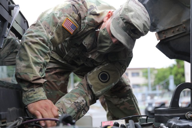 Sgt. Kalil Knight, a wheeled vehicle mechanic assigned to the 35th Combat Sustainment Support Battalion, works on a Humvee May 20 at the Transportation Motor Pool on Camp Zama, Japan.