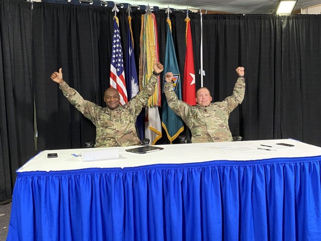 Brig. Gen. Milford H. 'Beags' Beagle Jr., Fort Jackson commander, and Post Command Sgt. Maj. Jerimiah Gan celebrate after the end of a virtual town hall June 18. It was Gan's last town hall as the post's senior enlisted leader. (Courtesy Photo)