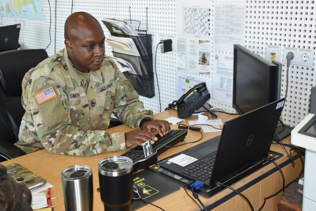 WIESBADEN, Germany - Sgt. 1st Class Latorrie Smith works June 25 at the Army Recruiting Station at the Exchange on Hainerberg. Smith has been a recruiter for more than 10 years and said he finds his job rewarding. “It gives me great pleasure to take an individual and see them transform from civilians into Soldiers.”