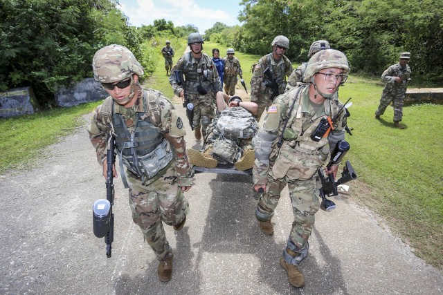 Officer candidates from the Guam National Guard, and ROTC Cadets from the University of Guam, train together in Barrigada on June 17. The joint exercises mark the first coordinated training effort between the two commissioning sources in over 10...