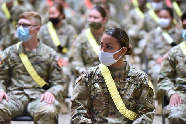 AIT Soldiers wearing face masks listen to Maj. Gen. Dennis LeMaster, Commander, U.S. Army Medical Center of Excellence during the MEDCoE Army National Hiring Days Soldier Forum on June 30, 2020 at Joint Base San Antonio-Fort Sam Houston, Texas. Spread out through several sessions that adhere to COVID-19 countermeasures, the MEDCoE Army National Hiring Days Soldier Forum will reached nearly 600 soldiers.