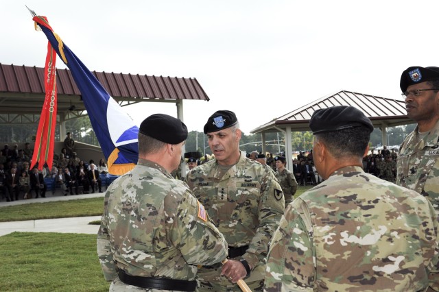 Gen. Gus Perna receives Army Materiel Command&#39;s colors from Gen. Mark A. Milley, the 39th Army Chief of Staff, while Gen. Dennis L. Via, outgoing AMC Commander, and Command Sgt. Maj. James K. Sims, AMC&#39;s Senior Enlisted Advisor, stand by. (US Army Photo).