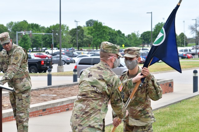 Col. Zorn T. Sliman, chief of staff of the Military Surface
Deployment and Distribution Command, passes the Headquarters, Headquarters Detachment guidon to 1st Lt. Molly McLean during a change of command ceremony at SDDC headquarters at Scott Air Force Base, Illinois June 29,
2020. (U.S. Army photo by John Orrell)