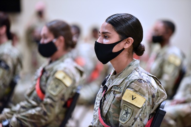 AIT Soldiers wearing face masks listen to Maj. Gen. Dennis LeMaster, Commander, U.S. Army Medical Center of Excellence during the MEDCoE Army National Hiring Days Soldier Forum on June 30, 2020 at Joint Base San Antonio-Fort Sam Houston, Texas. Spread out through several sessions that adhere to COVID-19 countermeasures, the MEDCoE Army National Hiring Days Soldier Forum will reached nearly 600 soldiers.