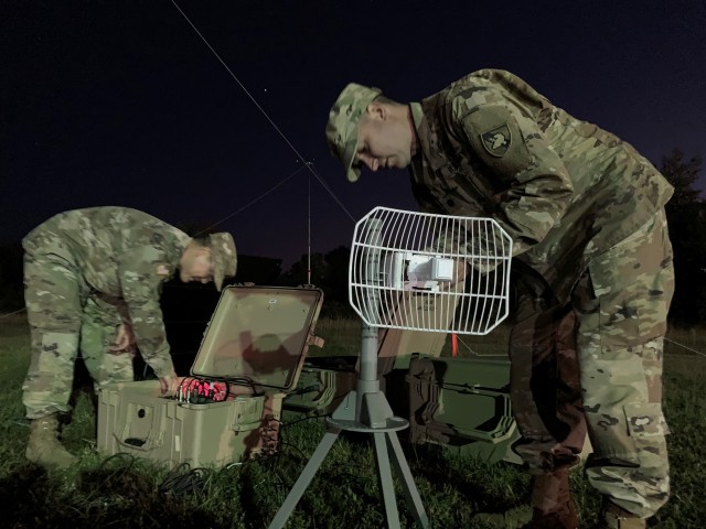 Pulling an all-nighter, members of the Army Cyber Institute demonstrate the capabilities of their High Frequency technology and equipment to Adam Nucci, HQDA cyber, during Cyber Blitz. Cyber Blitz is an HQDA-sponsored experimentation campaign to...