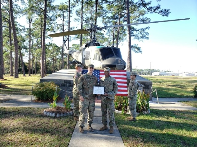 Sgt. Orion Murphy and 1st Lt. Wesley Johnson, along with flag holders, Staff Sgt. Brandon Williams and Sgt. Zackery Sansom, all from the 5th Squadron, 7th Cavalry Regiment, 1st Armored Brigade Combat Team, 3rd Infantry Division, conduct a...