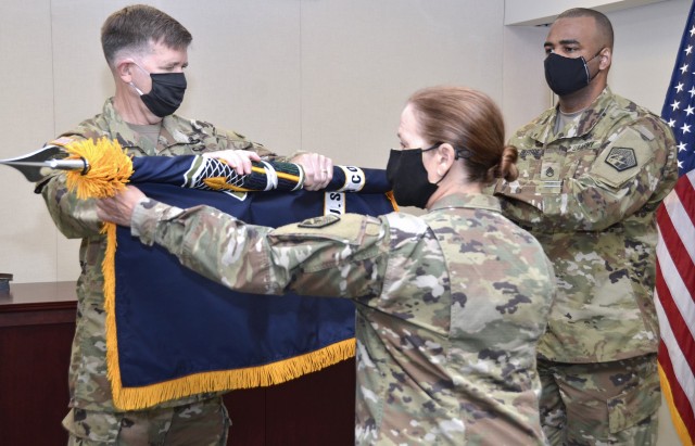 Lt. Gen. Stephen G. Fogarty, commadner of U.S. Army Cyber Command (left), and ARCYBER Command Sgt. Maj. Sheryl D. Lyon (center) prepare the ARCYBER colors for casing during a casing ceremony at Fort Belvoir, Va., July 1, 2020. The ceremony marked...