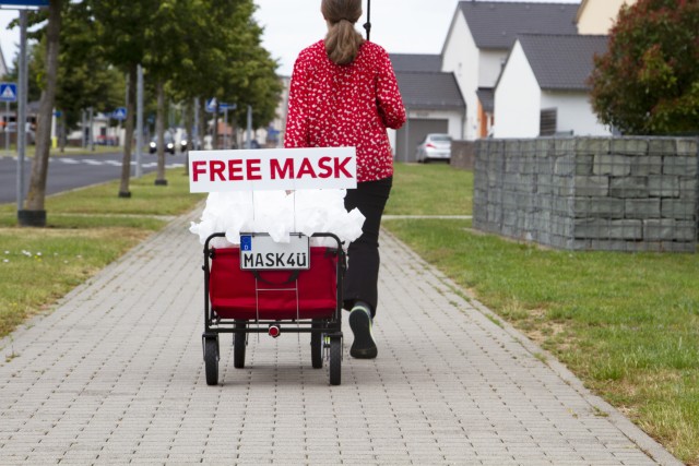 Laura Irick, a military spouse, walks around post to handout masks June 6 at U.S. Army Garrison Wiesbaden. Irick said the masks are 100% cotton and are made in sizes large (approximately 8 1/4” x 5”), medium (approximately 6 1/4” x 4...