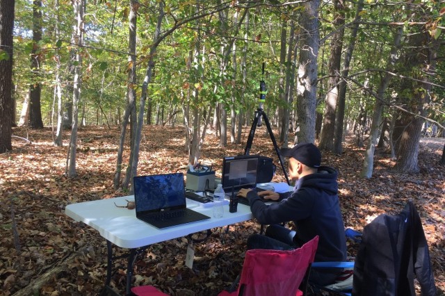 U.S. Army Combat Capabilities Development Command’s Army Research Laboratory computer scientist Mike Lee initializes Mockets in Integrated Sensor Architecture during the experiment in the remote woods setting.