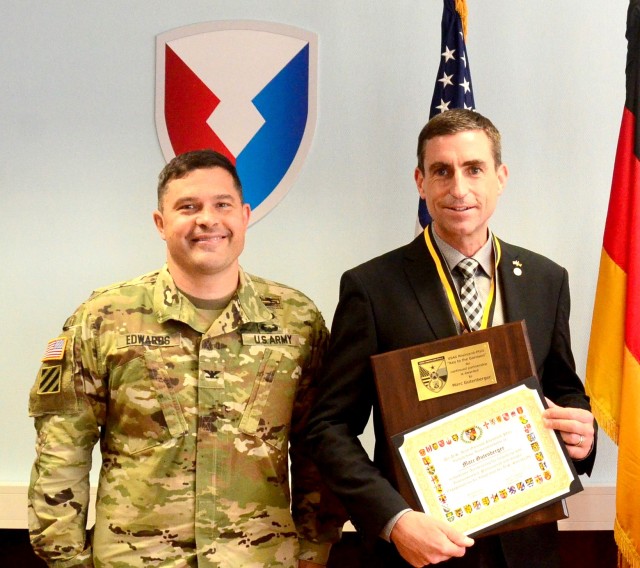 Marc Gutenberger, Chief of U.S. Construction Program with ABB state agency, right, poses with Col. Jason Edwards, U.S. Army Garrison Rheinland-Pfalz commander, after Edwards presented him a Key to the Garrison in a small ceremony in late June.