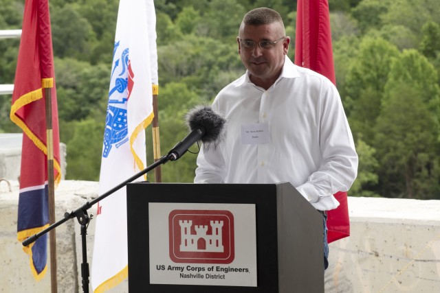 Steve Kohler, president and chief executive officer of Thalle Construction Corporation, speaks about the technical processes of constructing a roller compacted concrete berm and challenges the contractor faced and overcame during a ceremony July 1, 2020 in Silver Point, Tennessee, celebrating the completion of the $50 million RCC berm that stabilizes the left rim of Center Hill Lake and reduces risk of both an internal erosion foundation failure and a potential overtopping failure mode at the saddle dam. (USACE Photo by Leon Roberts)