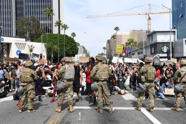 U.S. Soldiers of the California National Guard&#39;s 1st Squadron, 18th Cavalry Regiment, assist Los Angeles law enforcement by providing security during ongoing demonstrations, June 2, 2020. Cal Guard&#39;s role is to assist police officers with...