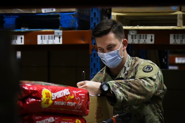 North Carolina Army National Guard Spc. Brandon Daniels, assigned to the 875th Engineer Company, records inventory information while collecting food for future distribution at the Mountain Area Nutritional Needs Alliance Foodbank in Asheville,...