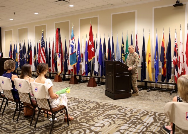 Kristy Lombardo and daughters Presley and Vivian listen to Col. Charles T. Lombardo, deputy commander Combined Arms Center-Training, as he speaks during the CAC-T Assumption of Responsibility Ceremony July 1, 2020 at the Frontier Conference...