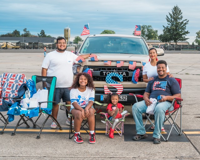 WIESBADEN, Germany - A family arrives early to Wiesbaden Army Airfield to decorate their truck for the Independence Day celebration. They were awarded a USO gift bag for their efforts July 4, 2020.