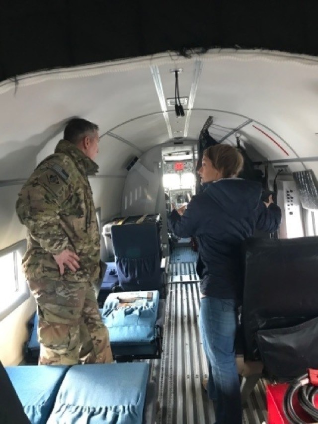 COL. Thomas Asbery, Former District Commander, New York District, U.S. Army Corps of Engineers being shown the interior of the JALBTCX aircraft.