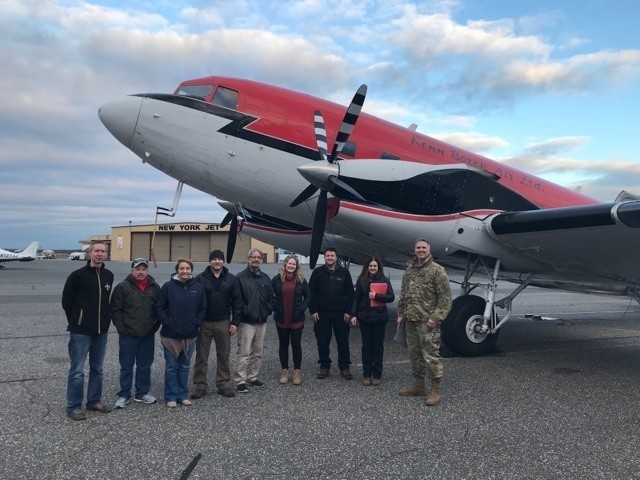 The JALBTCX team standing with COL. Thomas Asbery, Former District Commander, New York District, U.S. Army Corps of Engineers (far right), in front of their aircraft, at Long Island MacArthur Airport in Ronkonkoma, New York.