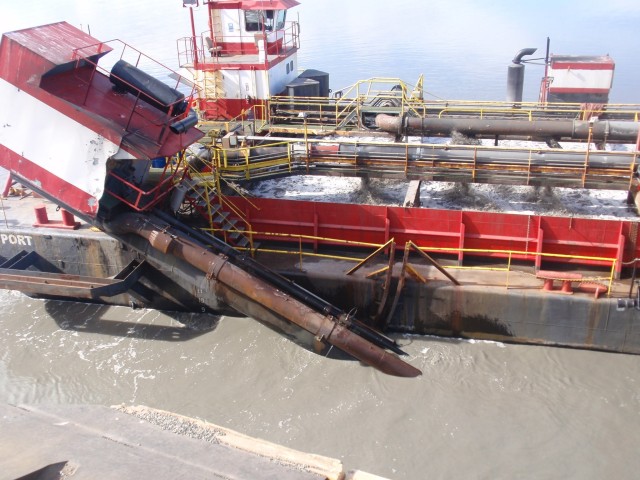 Sand, sediment and debris are removed from the seafloor by the Westport, a hopper dredge operated by Manson Construction, near the Port of Alaska on April 8, 2019. After dredging material is collected from the area near the docks, it is deposited...