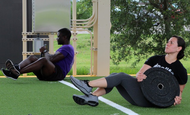 U.S. Special Operations Command-Central personnel participate in the initial exercise session after the ribbon cutting ceremony of the new human performance outdoor facility located on the SOCCENT campus at MacDill Air Force Base, Tampa, Fla.,...