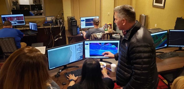 COL. Thomas Asbery, Former District Commander, New York District, U.S. Army Corps of Engineers watching the JALBTCX team working in their flight operations and data production center they stood up in a hotel conference room in Islip, New York.