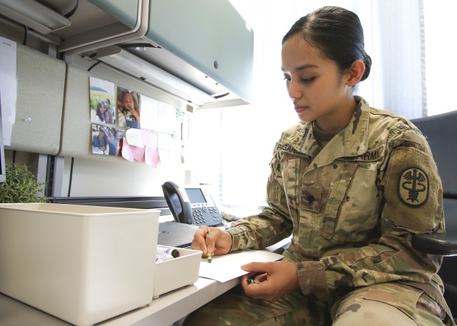 Spc. Chrisiellefaye Pagarigan, an occupational therapy specialist at Landstuhl Regional Medical Center, draws on a sheet of paper as a way to remain resilient during the COVID-19 restrictions, June 26. Pagarigan recently won an art competition for...