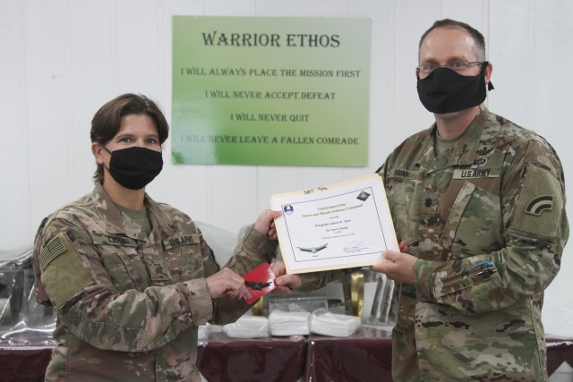 U.S. Army Spc. Jamie Tyra, from the Colorado National Guard's 117th Space Support Battalion, 1st Space Brigade, U.S. Army Space and Missile Defense Command, receives the Basic Space Badge, in CENTCOM's area of responsibility, June 26, 2020. The...