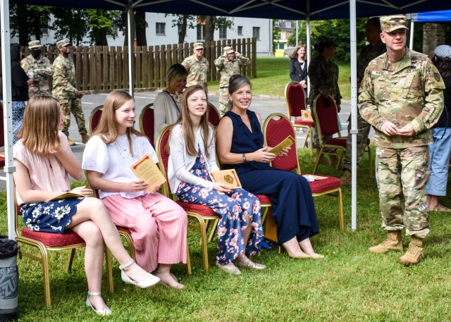 Col. Steven M. Pierce and his family wait for the change of command ceremonyto begin, July 8 at the Von Steuben Community Center on Bismarck Kaserne.