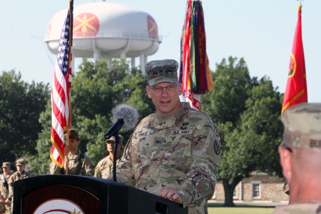 Col. Cobb Laslie speaks at the Army Capabilities Manager, Field Artillery Cannon Battalions, change of charter ceremony July 2, 2020, at the Old Post Quadrangle. FCoE and Fort Sill CG Maj. Gen. Kenneth Kamper praised Laslie and his team for...