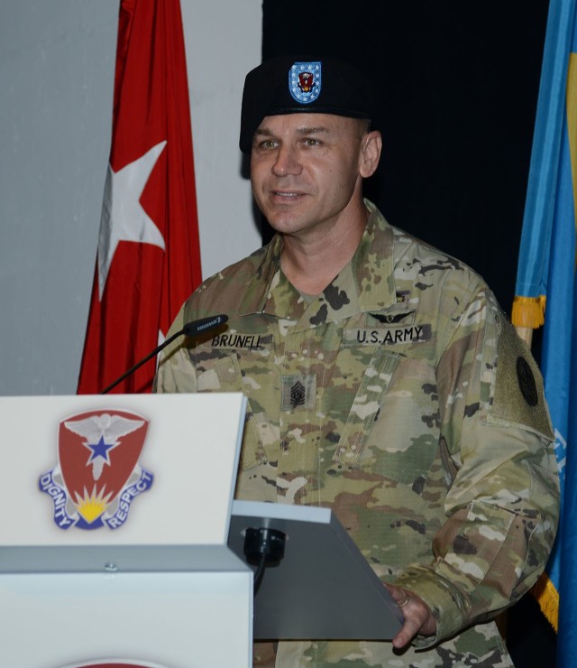 Command Sgt. Maj. Kyle Brunell delivers remarks during an assumption of command and assumption of responsibility ceremony July 9 at Kleber Kaserne, Germany.  Brunell assumed responsibility as the Regional Health Command Europe command sergeant major.