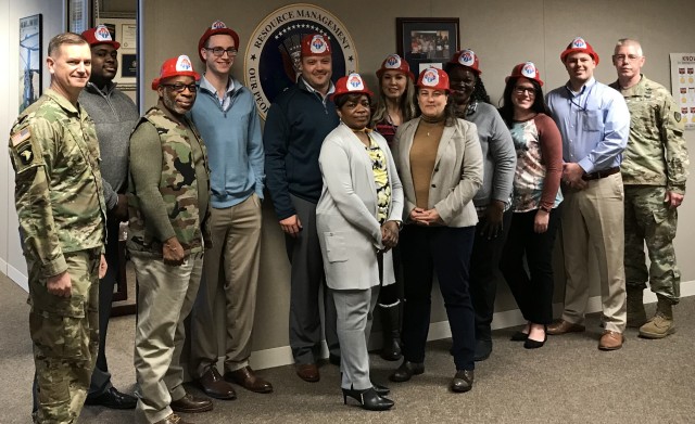The Commanding General of U.S. Army Aviation and Missile Command Commander, Maj. Gen. Todd Royar (far left) and AMCOM Command Sergeant Major, Command Sgt. Maj. Mike Dove (far right) recognize the G-8 Firefighters for their hard work in recovering...