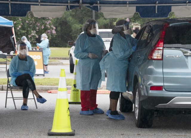 Volunteers take nasal swabs of Fort Jackson community members at a COVID-19 drive through testing at Fort Jackson July 8. The installation and the Medical University of South Carolina provided the testing. Testing will also take place July 10 from...