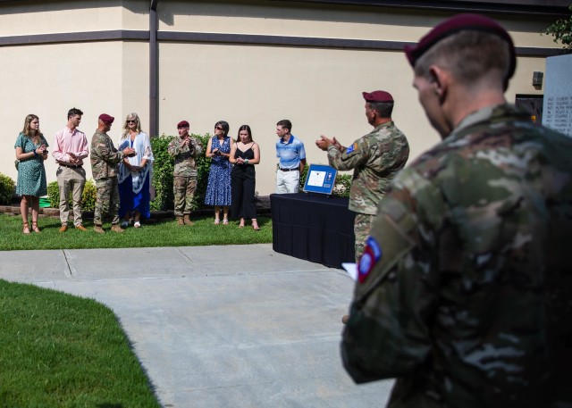 Lt. Gen. Erik Kurilla, commanding general of the XVIII Airborne Corps, presents Maj. Gen. James Mingus, Amy Mingus, Command Sgt. Maj. Burgoyne and Kate Burgoyne with awards while observing physical distancing safety precautions prior to the 82nd Airborne Division Change of Command and Change of Responsibility Ceremony on Fort Bragg, N.C., July 10, 2020. During the ceremony, Maj. Gen. Mingus relinquished command to Maj. Gen. Christopher T. Donahue and Command Sgt. Maj. Burgoyne relinquished responsibility to Command Sgt. Maj. David Pitt.