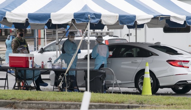 Volunteers take nasal swabs of Fort Jackson community members at a COVID-19 drive through testing at Fort Jackson July 8. The installation and the Medical University of South Carolina provided the testing. Testing will also take place July 10 from...