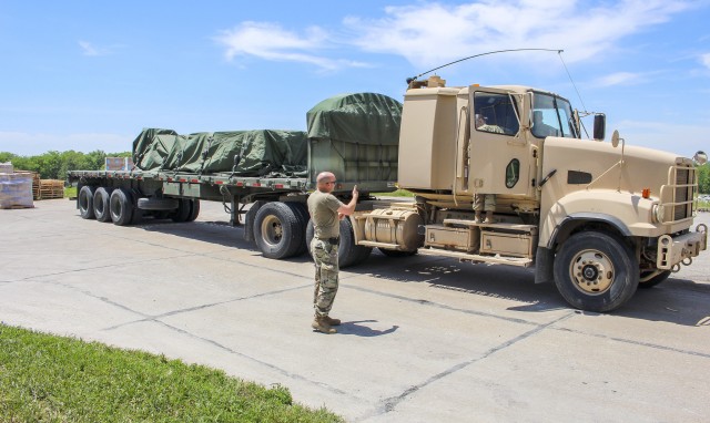 Nebraska Army National Guard Soldiers move personal protective equipment from a warehouse, June 2, 2020, in Lincoln, Nebraska. The Nebraska National Guard is responsible for supporting the Nebraska Department Administravtive Services by moving...